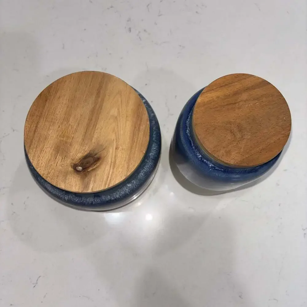 Set of 2 World Market Blue and Cream Ceramic Canisters Wooden Lids